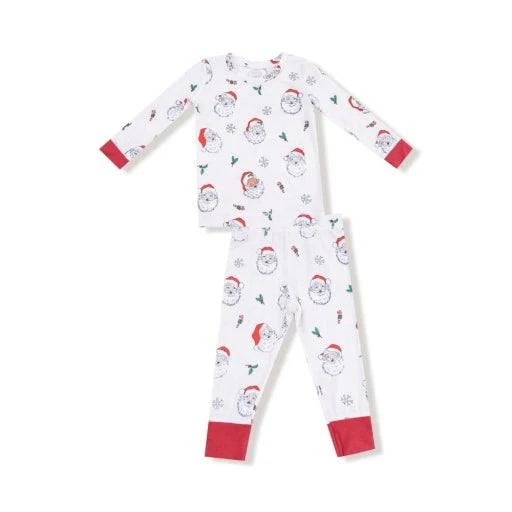 A two-piece children's pajama set featuring a white long-sleeve top and matching pants with an all-over snowman print and red cuffs.