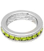 Silver ring with green gemstones on a white background