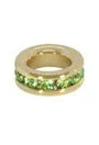 Gold ring with green gemstones on a white background
