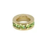 Gold ring with green gemstones on a white background