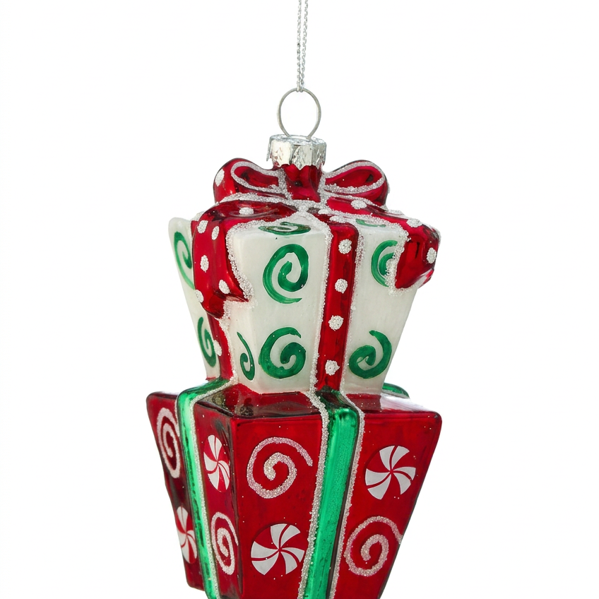 Stacked gift box ornament hanging with red bow, green accents, white patterned sides