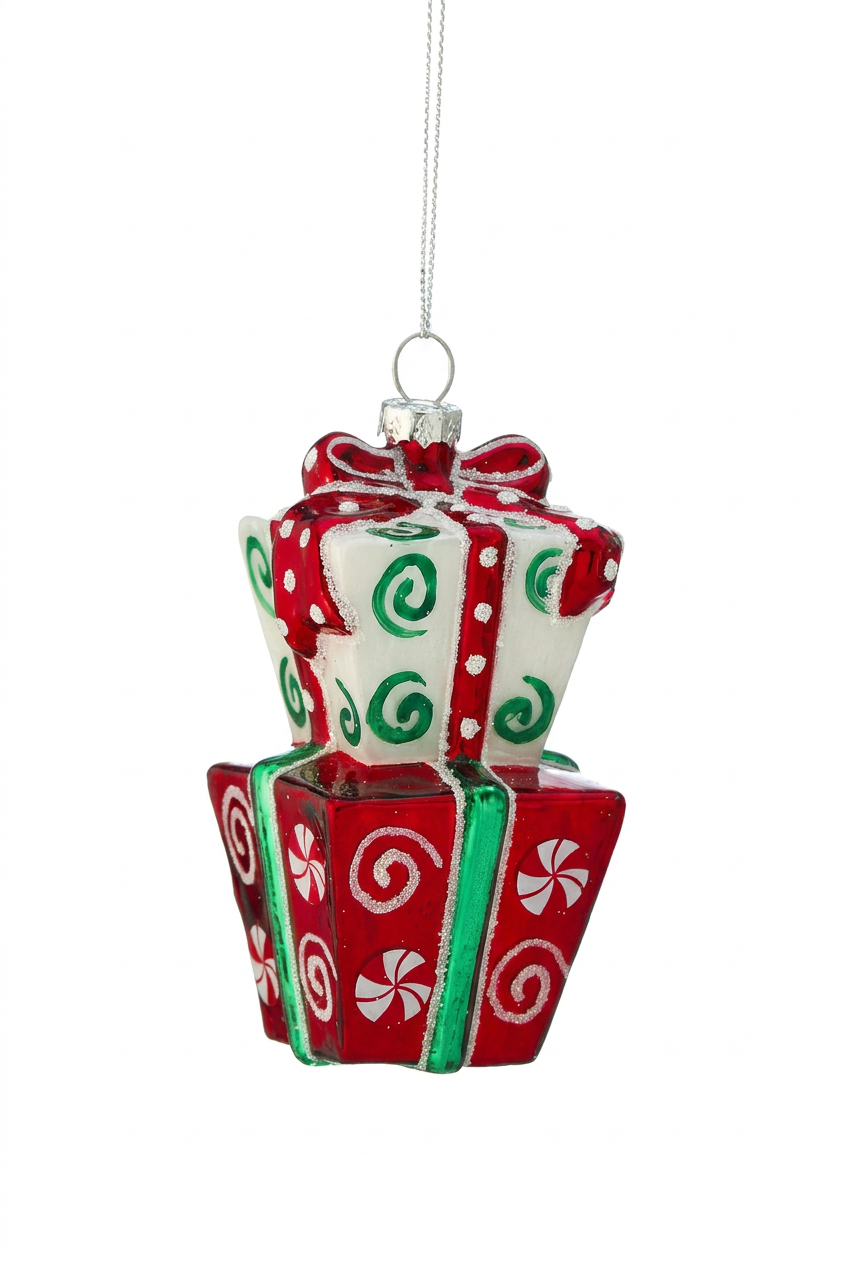 Stacked gift box ornament hanging with red bow, green accents, white patterned sides