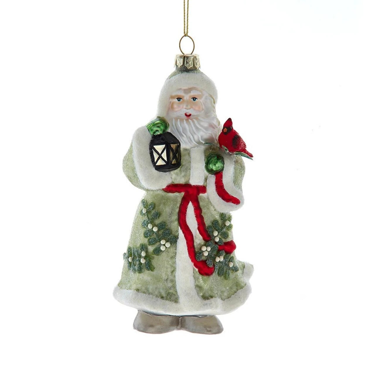 A vintage-style Santa Claus hanging ornament featuring a white-trimmed green robe, red sash, lantern, holly, and a red cardinal, shown against a plain white background.