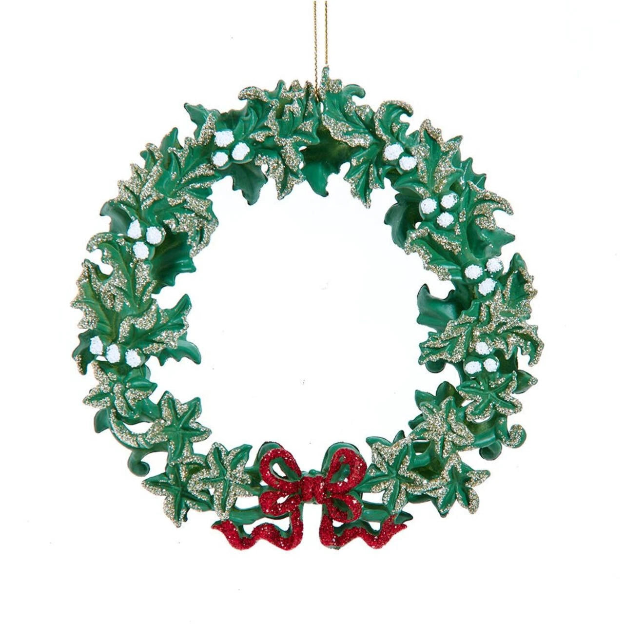 A green holly wreath Christmas ornament with silver glitter accents and a red glitter bow at the bottom, hanging against a plain white background.