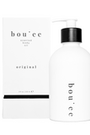 Boujèe scented body oil bottle with packaging on a white background