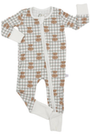 A baby long-sleeve footed sleeper with a white and light green plaid pattern, featuring a repeating brown owl print and solid white cuffs and footings, laid flat on a white background.