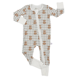 A baby long-sleeve footed sleeper with a white and light green plaid pattern, featuring a repeating brown owl print and solid white cuffs and footings, laid flat on a white background.