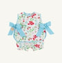 Floral baby romper with blue bows on a white background