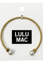 Gold bracelet with pearl beads on a Lulu Mac branded card