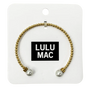Gold bracelet with pearl beads on a Lulu Mac branded card