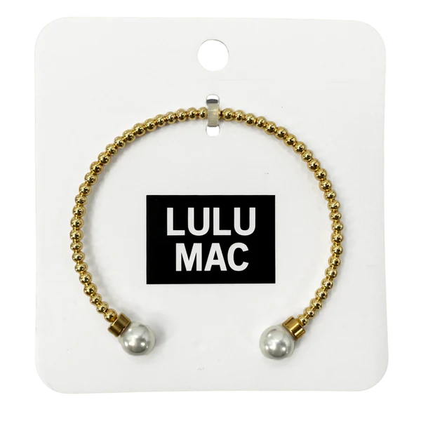 Gold bracelet with pearl beads on a Lulu Mac branded card