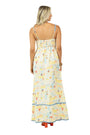 Woman wearing a long, patterned dress on a white background
